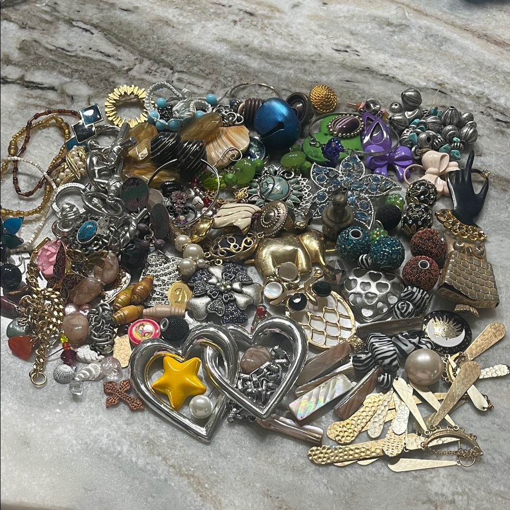 Hugh lot of craft jewelry. Odd earrings, beads, pins, missing stones, etc.